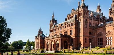 The grand buillding of Kelvingrove Art Gallery and Museum show casing it' s impressive architecture  on a bright sunny day 