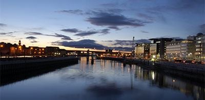 The calm waters of the river Clyde, illuninated by the city skyline