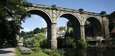 Viaduct over the River Nidd, with benches lining riverside