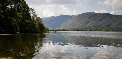 Calm waters of Derwent with large hills and dark forests