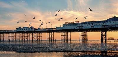 Starlings flying over the pier at Brighton