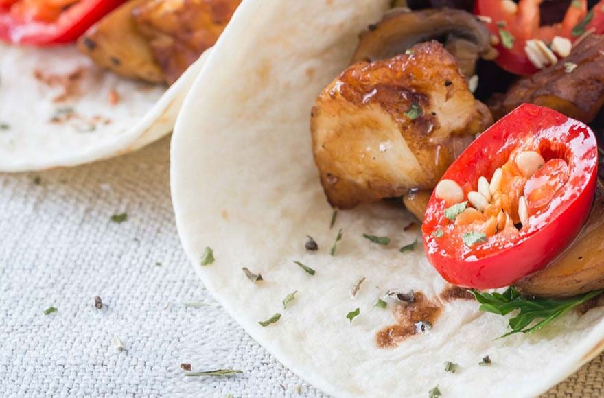 Tortillas filled with tomato, halloumi and herbs