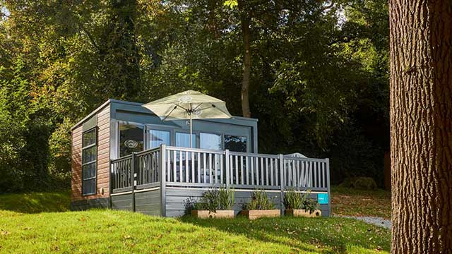 Stylish glamping pod with sunshade at Abbey Wood Club Campsite