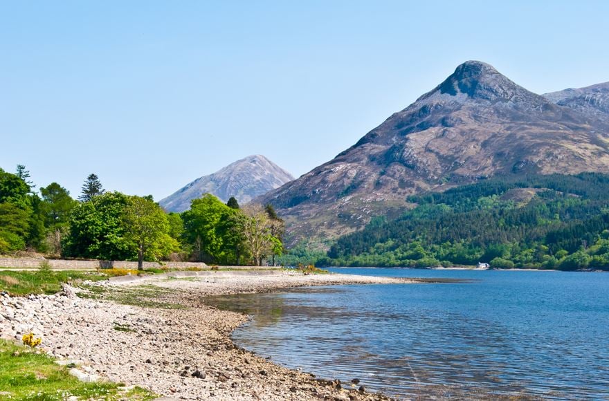 Shoreline of Loch Leven with mountains in the background