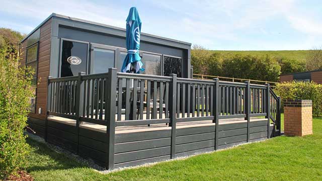 Exterior of Brighton glamping pod surrounded by gardens