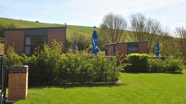 Brighton Club Campsite glamping pods surrounded by greenery