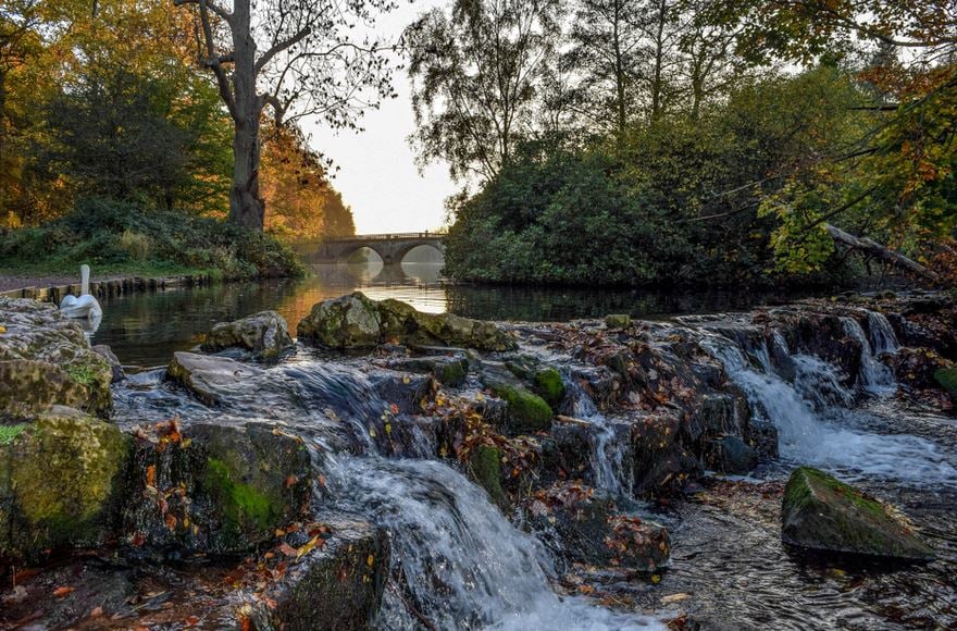 Water cascading over weir in Clumber Park