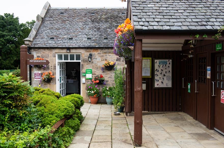 Stone building visitor entrance to the site