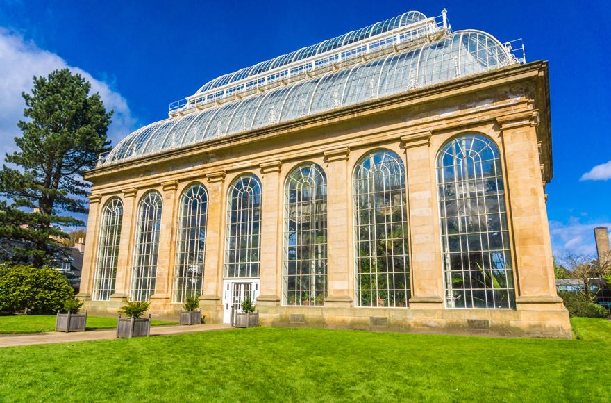 Palm Houses at Edinburgh Royal Botanical Gardens building relfecting the green landscape