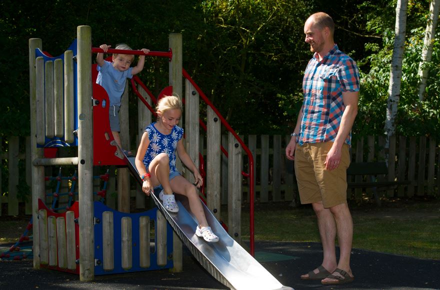 children playing in park at Ferry Meadows with parent supervising