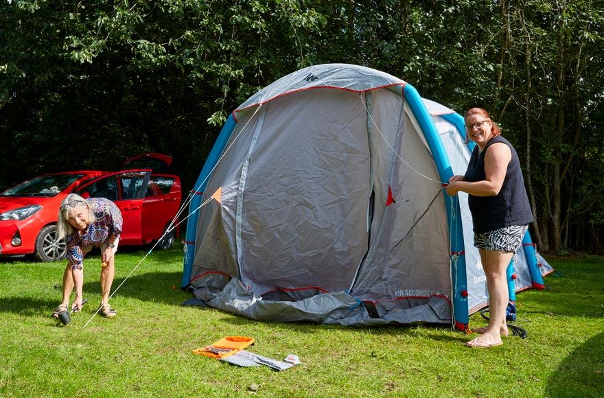 family setting up tent at Ferry Meadows