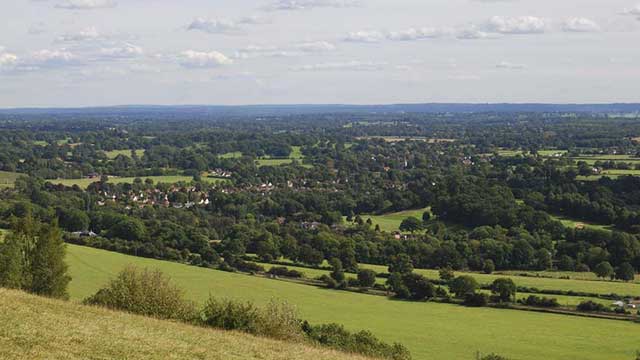 View from Box Hill overlooking leafy green hills, near Gatwick Club Campsite