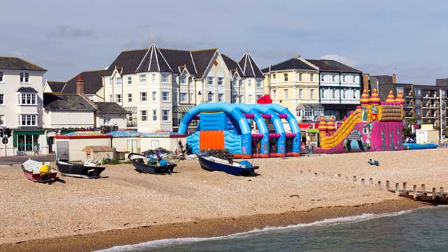 Colourful inflatable assault course at Bognor Regis beach, near Rowan Park Club Campsite