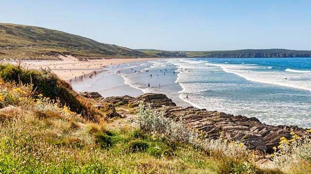 Blue sea and golden sand on Woolacombe beach