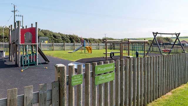 Playground at the campsite with slides, swings and climbing areas for young children