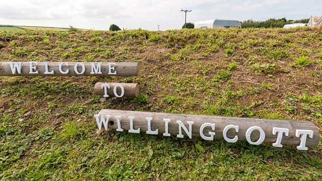 Wooden sign reads Welcome to Willingcott