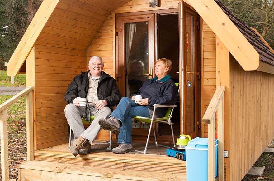 couple enjoying drink on the decking