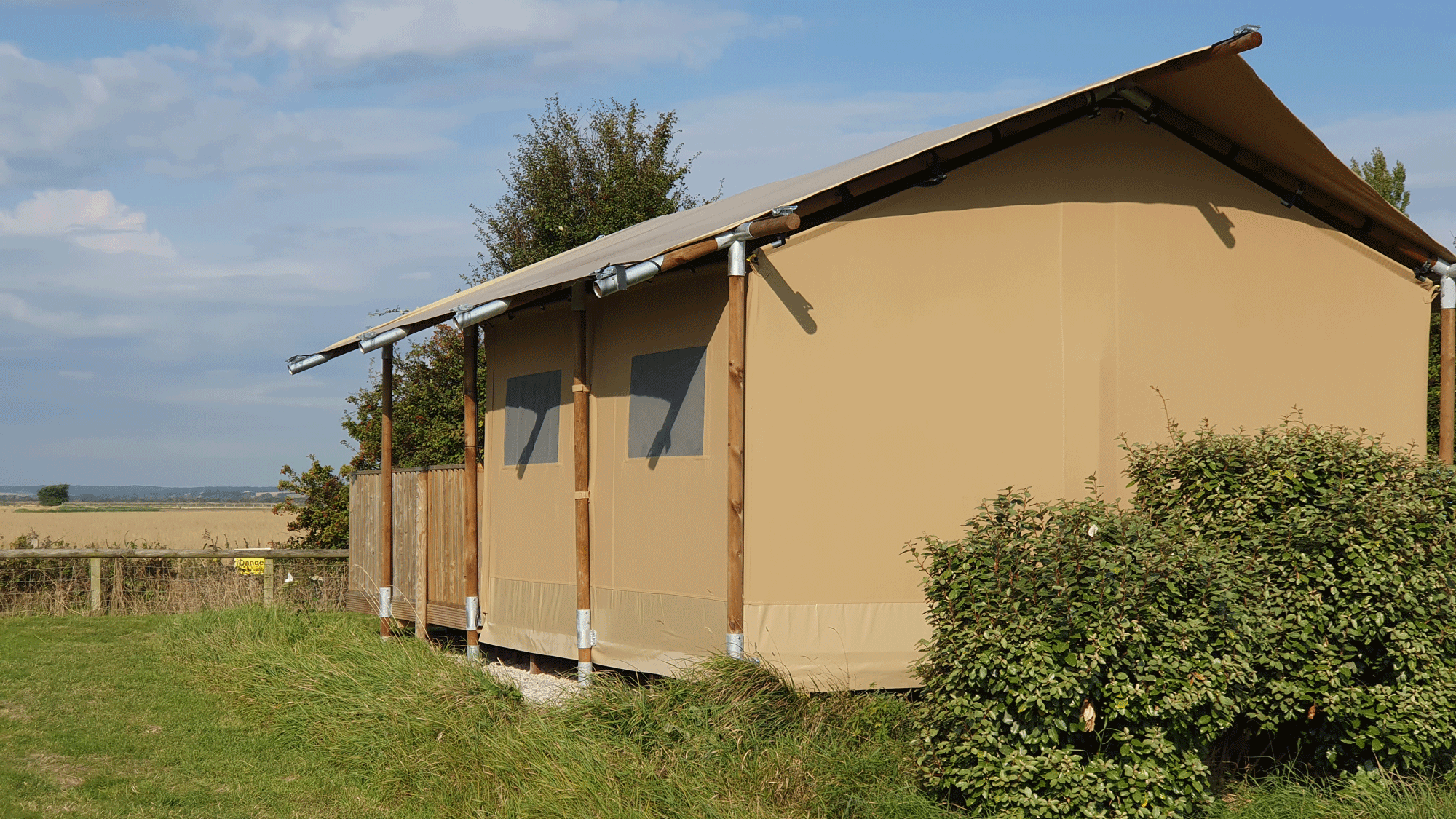 Safari tent with a view into the Kent countryside at the Daleacres Experience Freedom campsite.