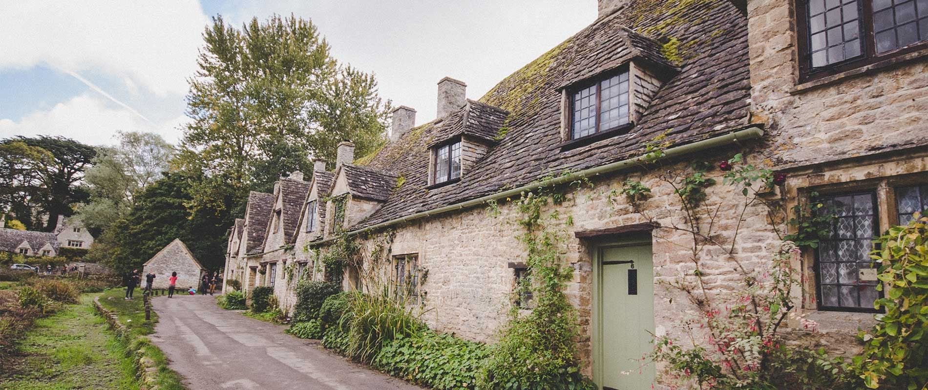 old stone houses line a street 