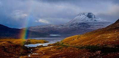 Rainbow across the large peak of Stac Pollaidh