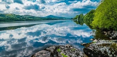 Bala lake reflecting sky and distant mountains