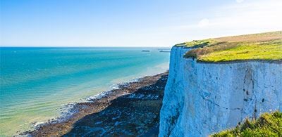 white cliffs of Dover against the clear blue sea 