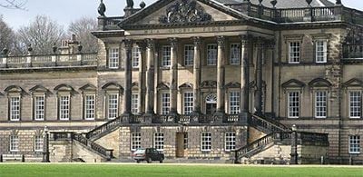 the grand building of Wentworth Woodhouse with  tidy gress garden 