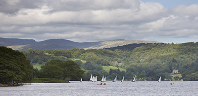Sail boats on Coniston Water at glamping site in Lake District